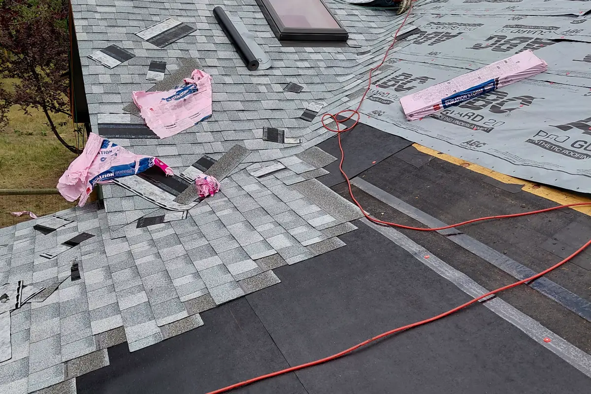 Self-adhered ice-and-water membrane and synthetic underlayment on a roof deck before shingles